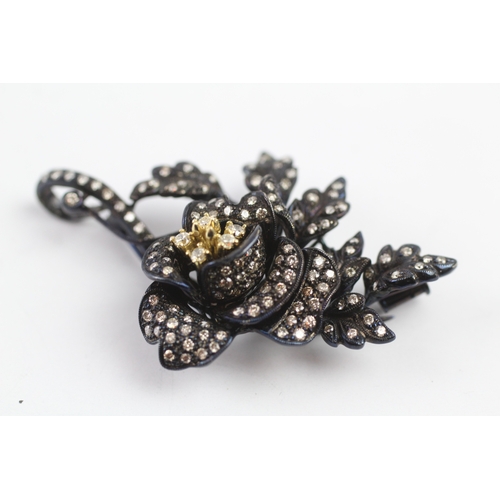 66 - 18ct gold diamond floral brooch (15.9g)