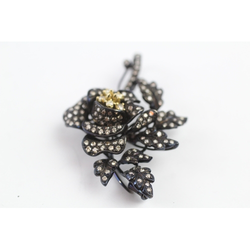 66 - 18ct gold diamond floral brooch (15.9g)