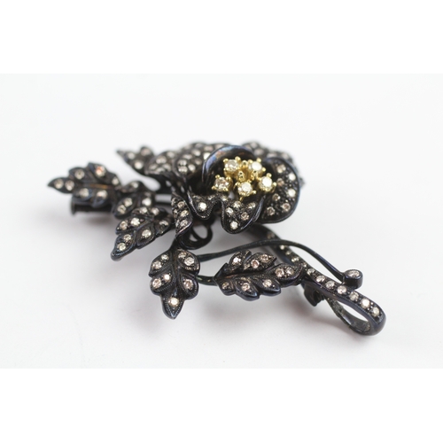 66 - 18ct gold diamond floral brooch (15.9g)