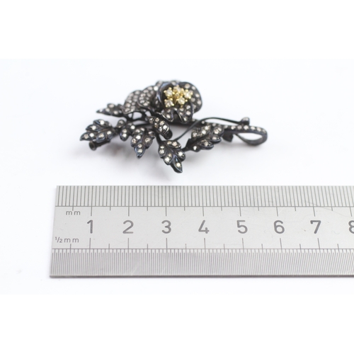 66 - 18ct gold diamond floral brooch (15.9g)