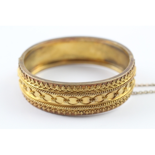 72 - 18ct gold ornate bangle (29.2g)