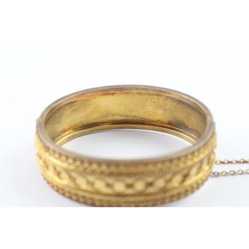 72 - 18ct gold ornate bangle (29.2g)