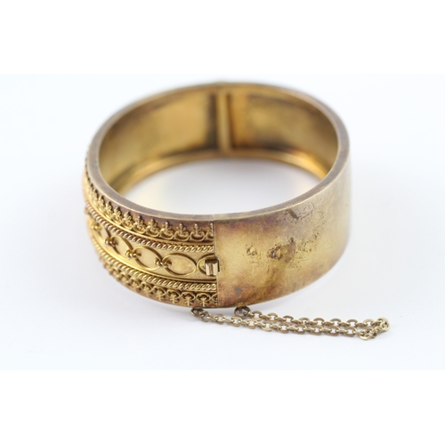 72 - 18ct gold ornate bangle (29.2g)