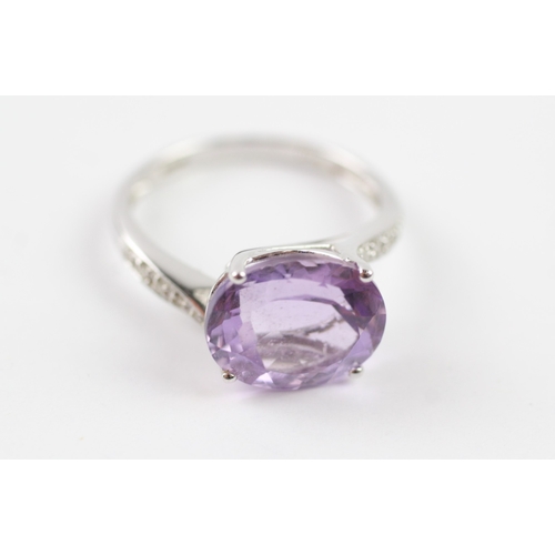 76 - 18ct white gold amethyst and diamond dress ring (3.3g) Size O