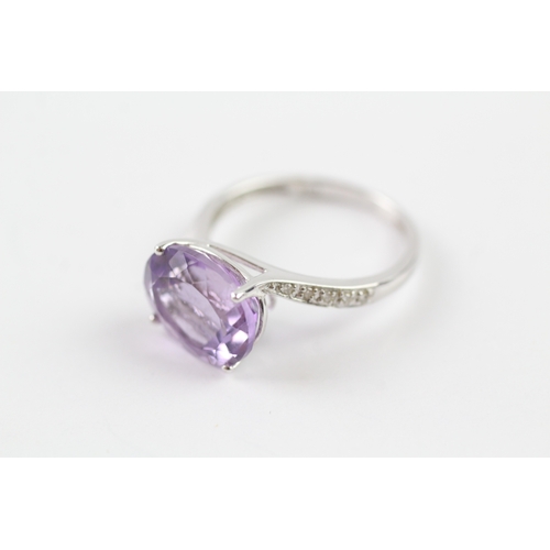 76 - 18ct white gold amethyst and diamond dress ring (3.3g) Size O