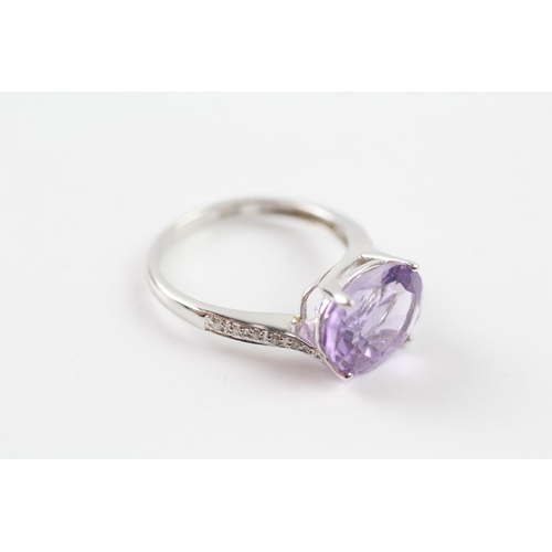 76 - 18ct white gold amethyst and diamond dress ring (3.3g) Size O