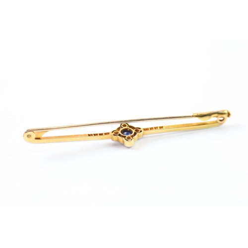 79 - 15ct gold diamond and sapphire bar brooch (6.1g)