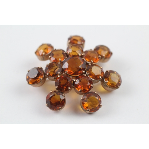 92 - 9ct gold citrine starburst brooch (7.1g)