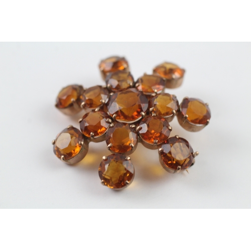 92 - 9ct gold citrine starburst brooch (7.1g)