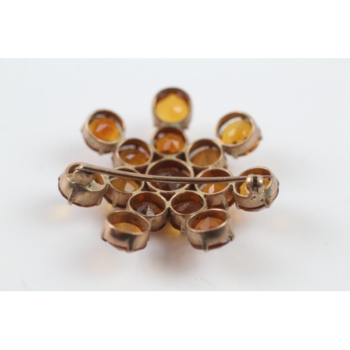 92 - 9ct gold citrine starburst brooch (7.1g)