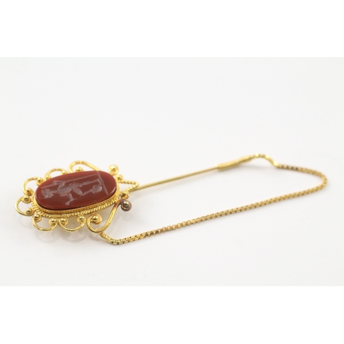 98 - 18ct gold carved carnelian stick pin (5.7g)