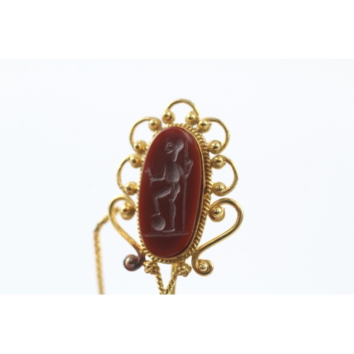 98 - 18ct gold carved carnelian stick pin (5.7g)