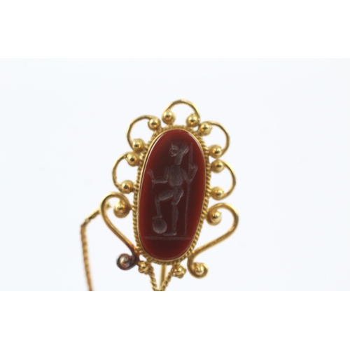 98 - 18ct gold carved carnelian stick pin (5.7g)