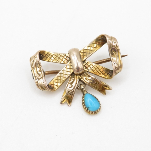 157 - 9ct gold bow brooch with turquoise drop (2.5g)