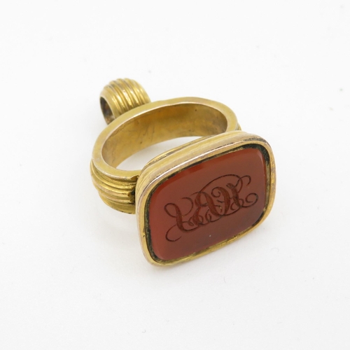 424 - 9ct gold cased carved carnelian seal fob (7.8g)