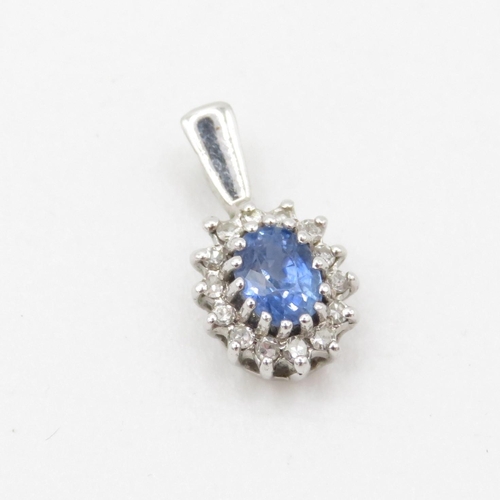 441 - 9ct white gold diamond and sapphire halo pendant (0.7g)