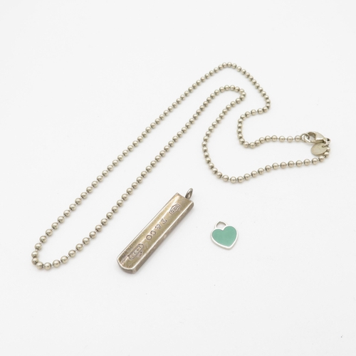 565 - A silver chain and two pendants by Tiffany and Co (19g)