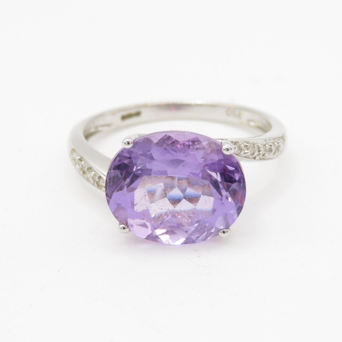 76 - 18ct white gold amethyst and diamond dress ring (3.3g) Size O