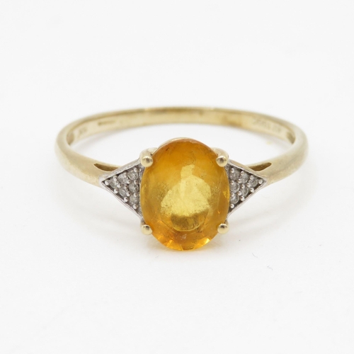 127 - 9ct gold diamond and citrine set dress ring (1.9g) Size U