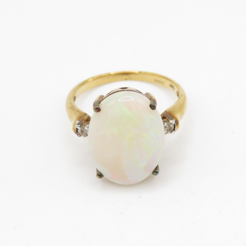 233 - 9ct gold opal and white gemstone ring (3.6g) Size N