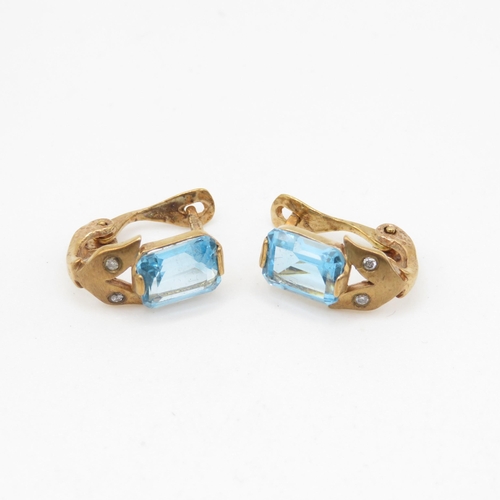 236 - 9ct gold blue topaz & diamond clip and post earrings (2.8g)