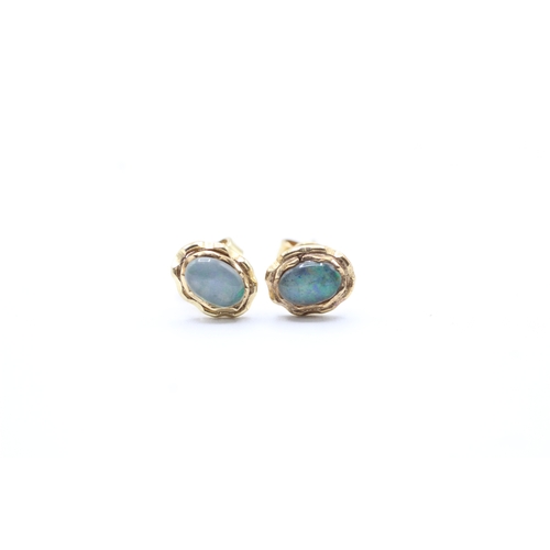 107 - 14ct gold opal doublet stud earrings (1.5g)