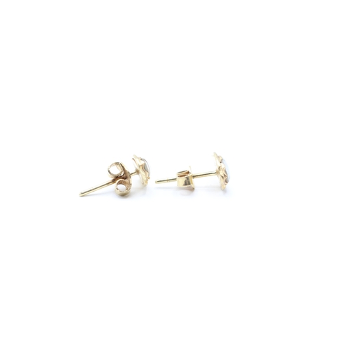 107 - 14ct gold opal doublet stud earrings (1.5g)