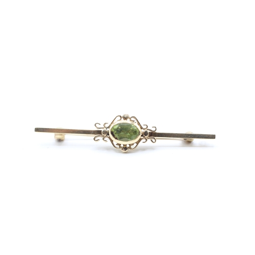 124 - 9ct gold vintage peridot brooch (3.4g)