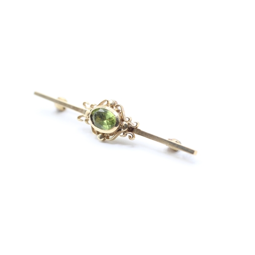 124 - 9ct gold vintage peridot brooch (3.4g)