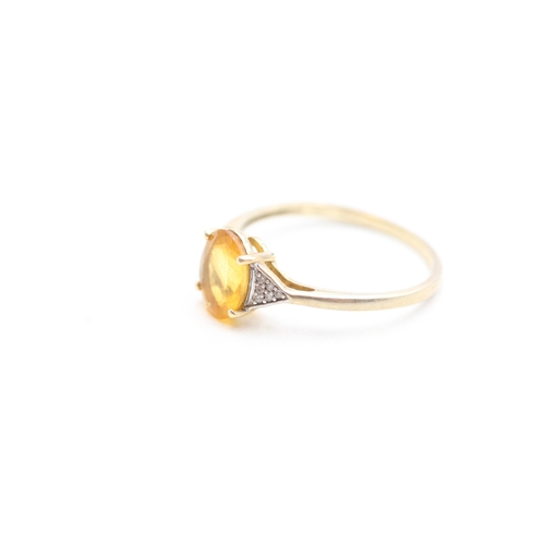 127 - 9ct gold diamond and citrine set dress ring (1.9g) Size U