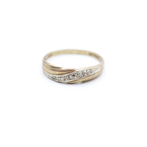 133 - 9ct gold diamond set band ring (1.7g) Size P 1/2