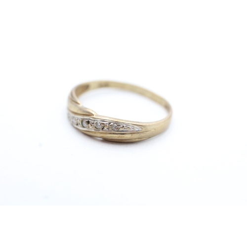 133 - 9ct gold diamond set band ring (1.7g) Size P 1/2