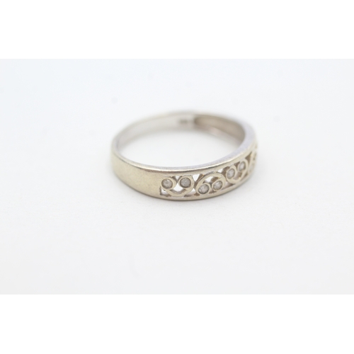 147 - 9ct gold flush set diamond ring (1.8g) Size N