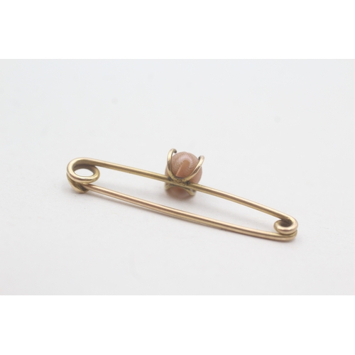 165 - 9ct gold cowry shell bar brooch (0.8g)