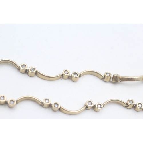 187 - 9ct gold and diamond bracelet (7.1g)