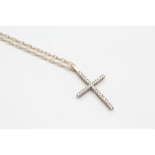 196 - 9ct gold and diamond cross pendant on chain (2.7g)