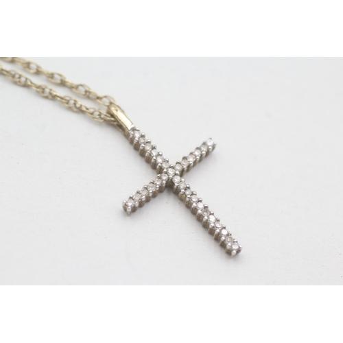 196 - 9ct gold and diamond cross pendant on chain (2.7g)