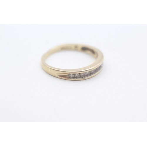 201 - 9ct gold diamond channel set ring (2.3g) Size O