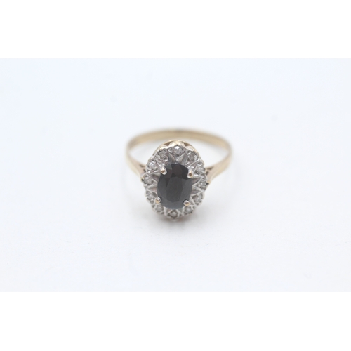 204 - 9ct gold sapphire and diamond halo setting ring (2.1g) Size M