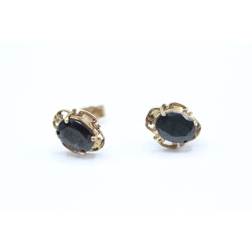 209 - 9ct gold oval cut sapphire set stud earrings (1.4g)