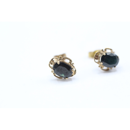 209 - 9ct gold oval cut sapphire set stud earrings (1.4g)