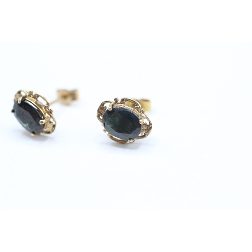 209 - 9ct gold oval cut sapphire set stud earrings (1.4g)