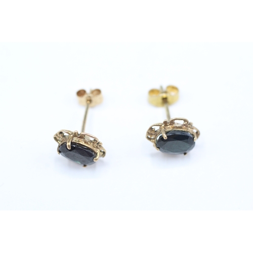 209 - 9ct gold oval cut sapphire set stud earrings (1.4g)