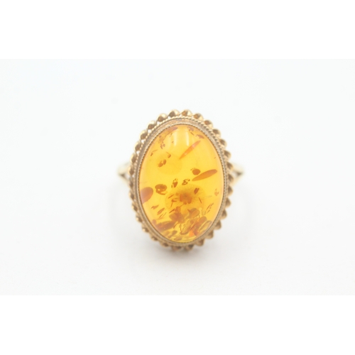 225 - 9ct gold amber cocktail ring (4g) Size P