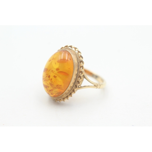 225 - 9ct gold amber cocktail ring (4g) Size P