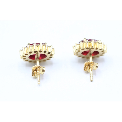 229 - 18ct gold diamond & glass filled ruby oval cluster stud earrings (5.6g)