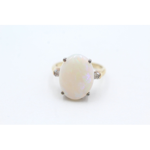 233 - 9ct gold opal and white gemstone ring (3.6g) Size N