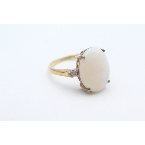 233 - 9ct gold opal and white gemstone ring (3.6g) Size N