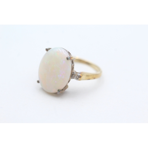 233 - 9ct gold opal and white gemstone ring (3.6g) Size N