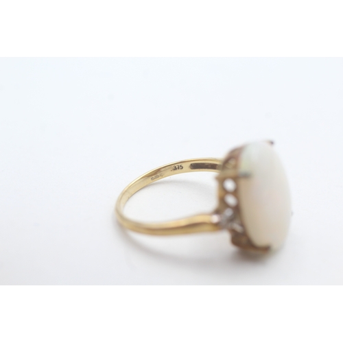 233 - 9ct gold opal and white gemstone ring (3.6g) Size N